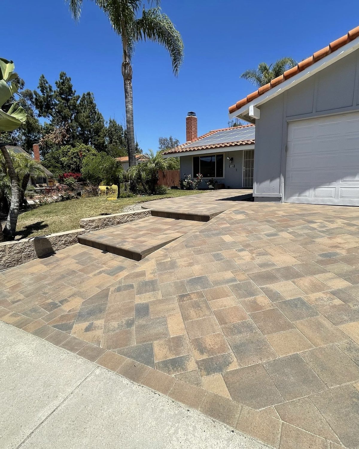 New paver driveway and entry steps on a San Diego home